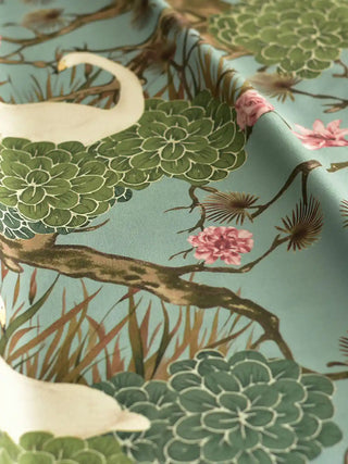 A draped view of the Silk Route blue fabric showing the soft textile texture and the detailed botanical Chinoiserie print.
