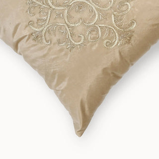 A detailed close-up of the Silken Ornate cushion highlighting the texture of the gold metallic embroidery and silk-finish fabric.