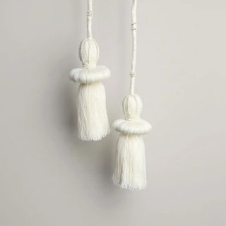 Close-up shot of the Silkstone Holdback hanging, highlighting the distinct tiered shape and the detailed beading that resembles a small crown.