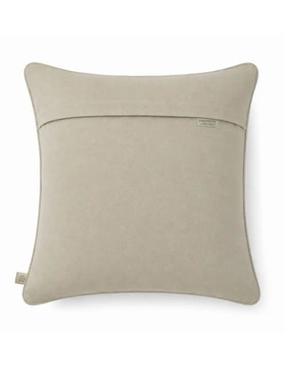 The reverse side view of the Siroye cushion cover showing the plain linen backing, hidden zipper flap, and brand woven tag.