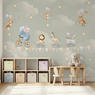 A luxury playroom setting featuring the sage green sky parade mural above a wooden table and toy kitchen.