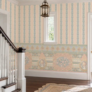 The Songbird Garden Stripe wallpaper along a staircase wall with a white balustrade, brass lantern and warm wood flooring. view-staircase