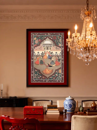 A grand dining room featuring the Sorena heritage mural styled above a wooden table with a crystal chandelier and blue ceramics.