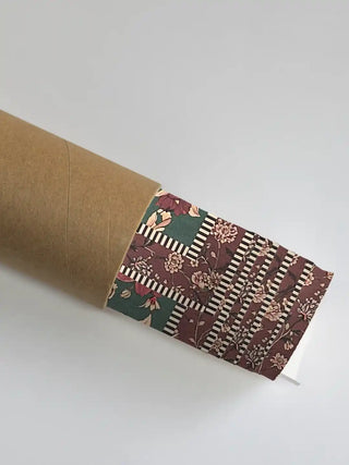 A section of the Sorena art showing the striped border and floral pattern partially unrolled from its protective shipping tube.