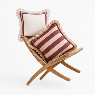 Spellbound and Cinnamon ruffle cushion covers on a rattan folding chair, ivory with maroon border and maroon stripe