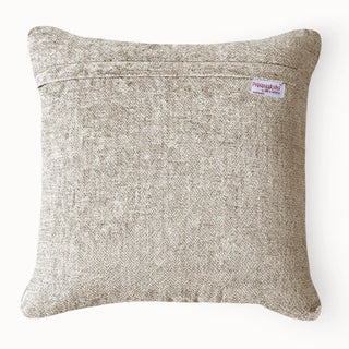 Back view of the cushion showing the solid beige textured fabric and brand label.