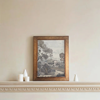 A framed monochrome forest-themed wall art displayed above a decorative ledge with minimal white accents.