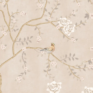 A close-up of the Sunset Serenade chinoiserie wallpaper pattern in Blush Beige, showing branches, white blossoms and a perched bird.