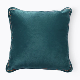 A full-front view of the teal velvet cushion featuring an intricate golden scalloped embroidered border.