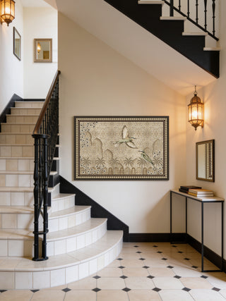 The Birds of Anqa large framed heritage canvas wall art styled seamlessly on a main accent wall inside a grand double-height staircase entry foyer hall.