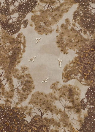 A detailed macro close-up of The Forest Nest embroidered wall art highlighting raised bird embroidery, beadwork and metallic-thread leaf detailing.