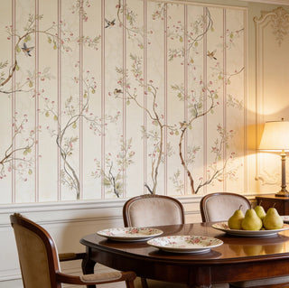 The Syntax of Spring custom scenic floral wallpaper paneled inside a formal European-style dining room behind a polished mahogany table and chairs view-diningroom
