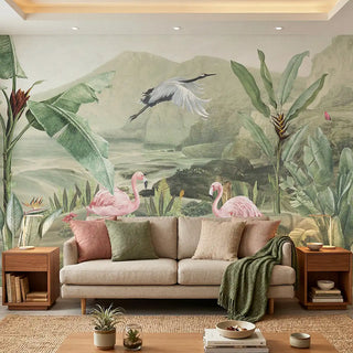 A full panoramic view of the Tropical Jungle mural styled in a modern living room behind a beige sofa and wooden side tables view- living room
