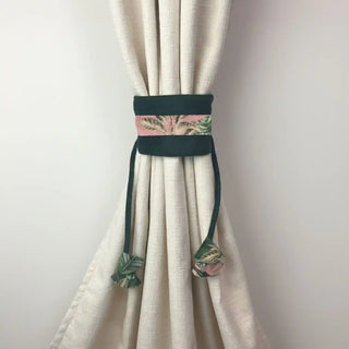 Forest Muse Handcrafted Curtain Holdback secured around a textured cream curtain, showcasing the tropical leaf print on the central panel