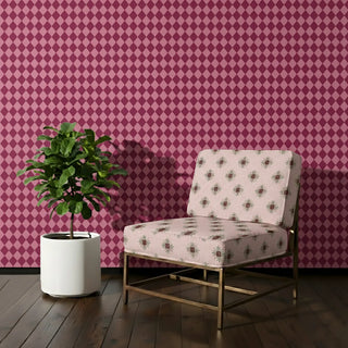 Utsav Sofa and Chair Upholstery Fabric in soft pink with green floral motifs, styled on a lounge chair.