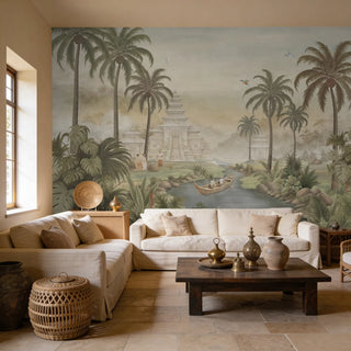 A vintage Chinoiserie tropical landscape mural in antique sage behind a neutral sectional sofa and rustic wooden coffee table.
