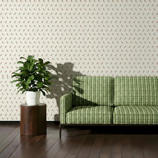 Living room styled with Vineyard Green Sofa Upholstery Fabric featuring a patterned green sofa paired with a potted plant and wooden flooring.
