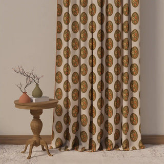 The Vintage Blossom Pipin curtain showcasing its repeating pattern of large, ornate vintage ovals in warm tones of terracotta and olive green.