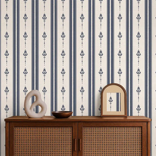 Vintage Navy & Beige Motif Stripe Wallpaper Roll applied in a living room, styled with a cane cabinet, mirror, and decorative accents, highlighting its bold navy and beige stripe design.