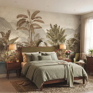 The Vintage Tropical Foliage botanical mural styled behind a sage green upholstered bed in a serene, luxury bedroom view-bedroom
