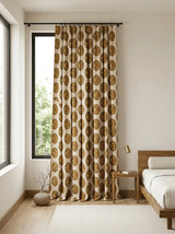 Patterned Vintage Blossom curtain in a bedroom with a bed and side table.
