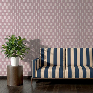 Modern sofa upholstered in Vista Fabric with wide navy and beige stripes, adding a striking statement against a patterned wall.