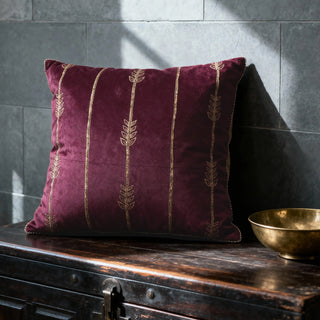 Single Zahra Vine Cushion Cover displayed on a dark wooden chest with a brass bowl.