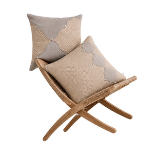 Zayan Weave and Sirocco cushion covers on a rattan folding chair, jute weave with grey scalloped panels and pearls